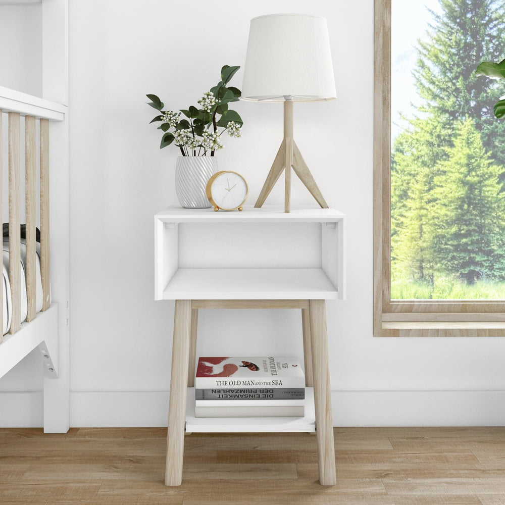 Max & Lily Mid-Century Modern Cubby Night Stand in White/Blonde - shown next to a bunk bed with a lamp, plant, and books stored on the bottom shelf.