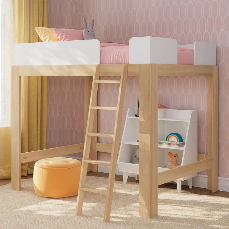 Max & Lily Mid-Century Modern Full High Loft Bed in White/Blonde - angled view in a pink bedroom with the ladder, an under-bed cube bookshelf, and an orange pouf.