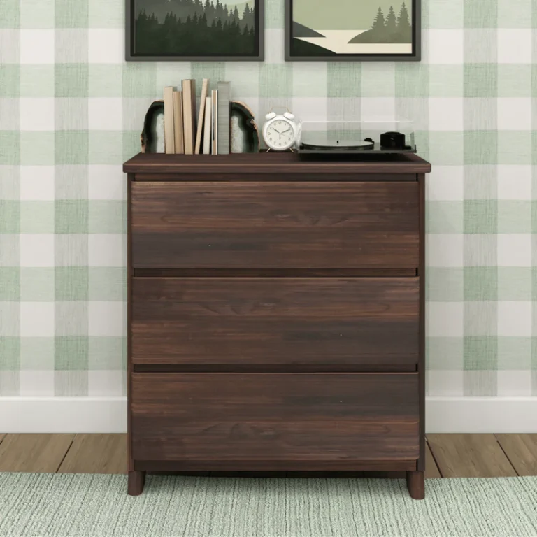 Max & Lily Modern Farmhouse 3 Drawer Dresser in Barnwood Brown - front view in a styled bedroom with a record player, clock and books on top