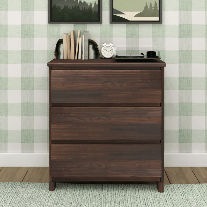 Max & Lily Modern Farmhouse 3 Drawer Dresser in Barnwood Brown - front view in a styled bedroom with a record player, clock and books on top