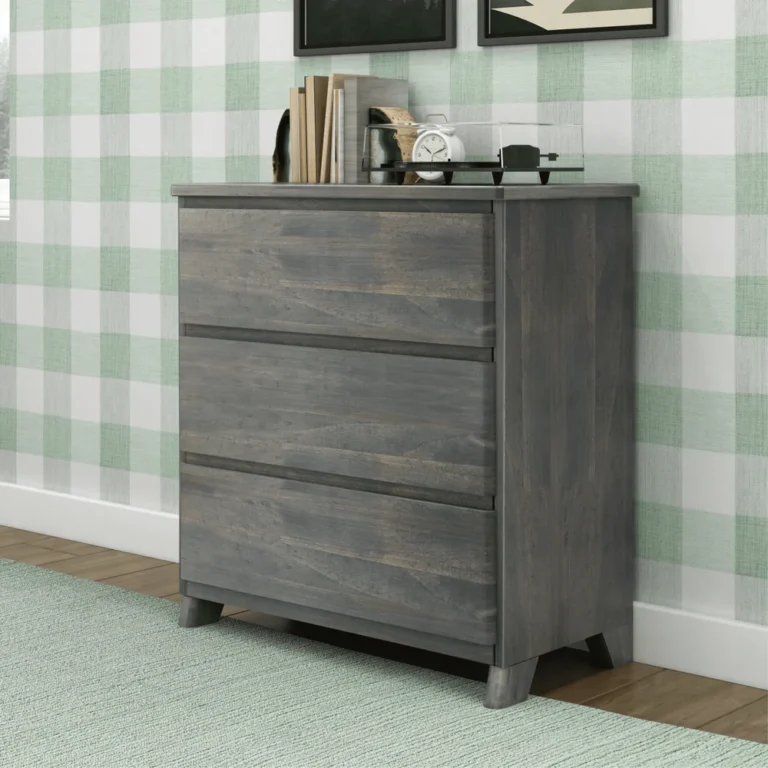 Max & Lily Modern Farmhouse 3 Drawer Dresser in Driftwood - angled view in a bedroom showing the solid wood top and three wide drawers