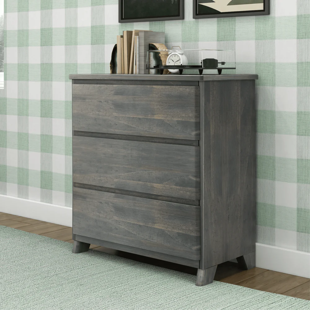 Max & Lily Modern Farmhouse 3 Drawer Dresser in Driftwood - angled view in a bedroom showing the solid wood top and three wide drawers