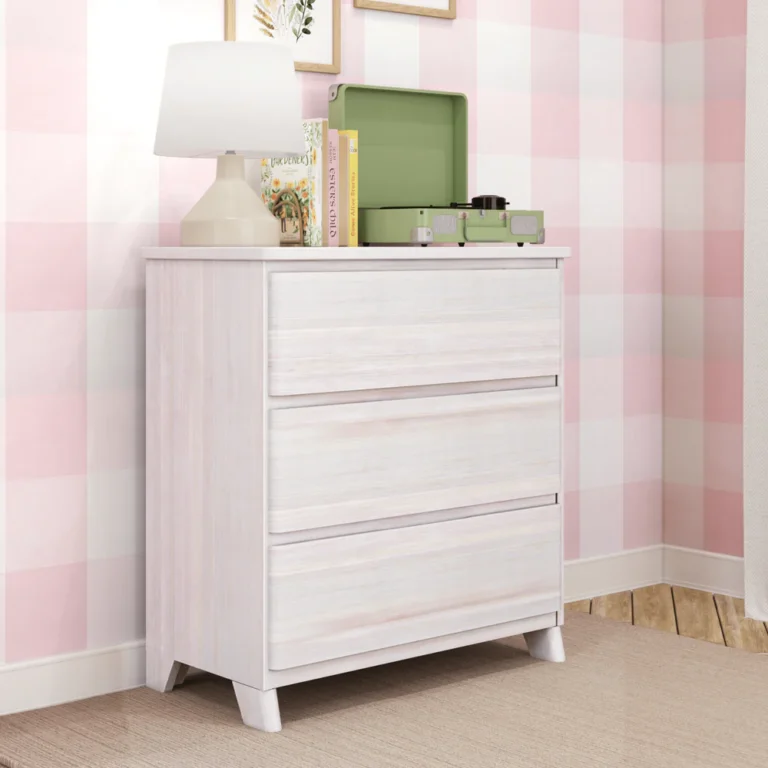 Max & Lily Modern Farmhouse 3 Drawer Dresser in White Wash - angled view in a kids bedroom showing the three drawers and splayed legs