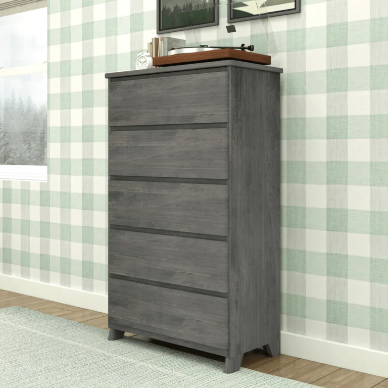 Max Lily Modern Farmhouse 5 Drawer Dresser Driftwood Angle View 2 Max & Lily Modern Farmhouse 5 Drawer Dresser in Driftwood - angled view in a bedroom beside a window with a record player on top