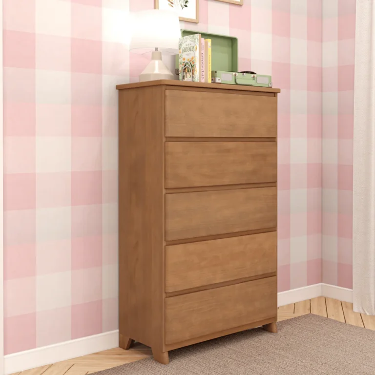 Max Lily Modern Farmhouse 5 Drawer Dresser Pecan Angle View 2 Max & Lily Modern Farmhouse 5 Drawer Dresser in Pecan - angled view in a corner bedroom with a lamp and books on top.