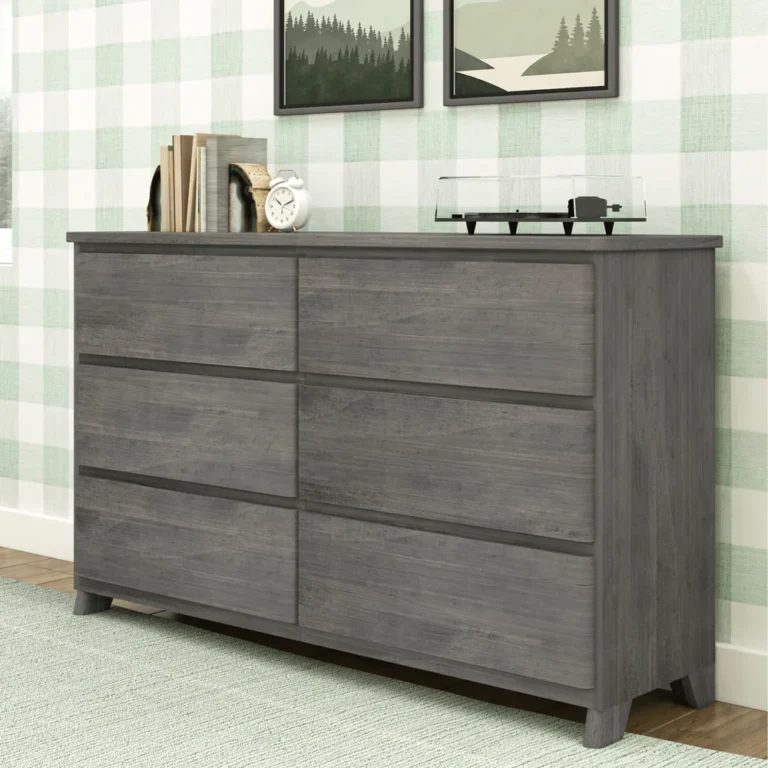 Max Lily Modern Farmhouse 6 Drawer Dresser Driftwood Angled Room Scene Max & Lily Modern Farmhouse 6 Drawer Dresser in Driftwood - angled view in a room setting with decor on top against gingham wallpaper.