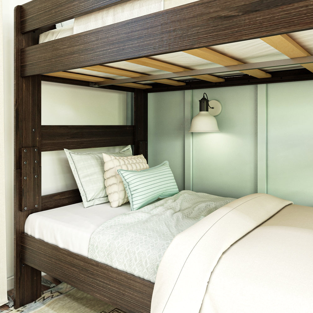 Max & Lily Modern Farmhouse Twin Over Twin Bunk Bed in Barnwood Brown - close-up of the lower bunk with pillows and the wooden slat support beneath the upper bunk.