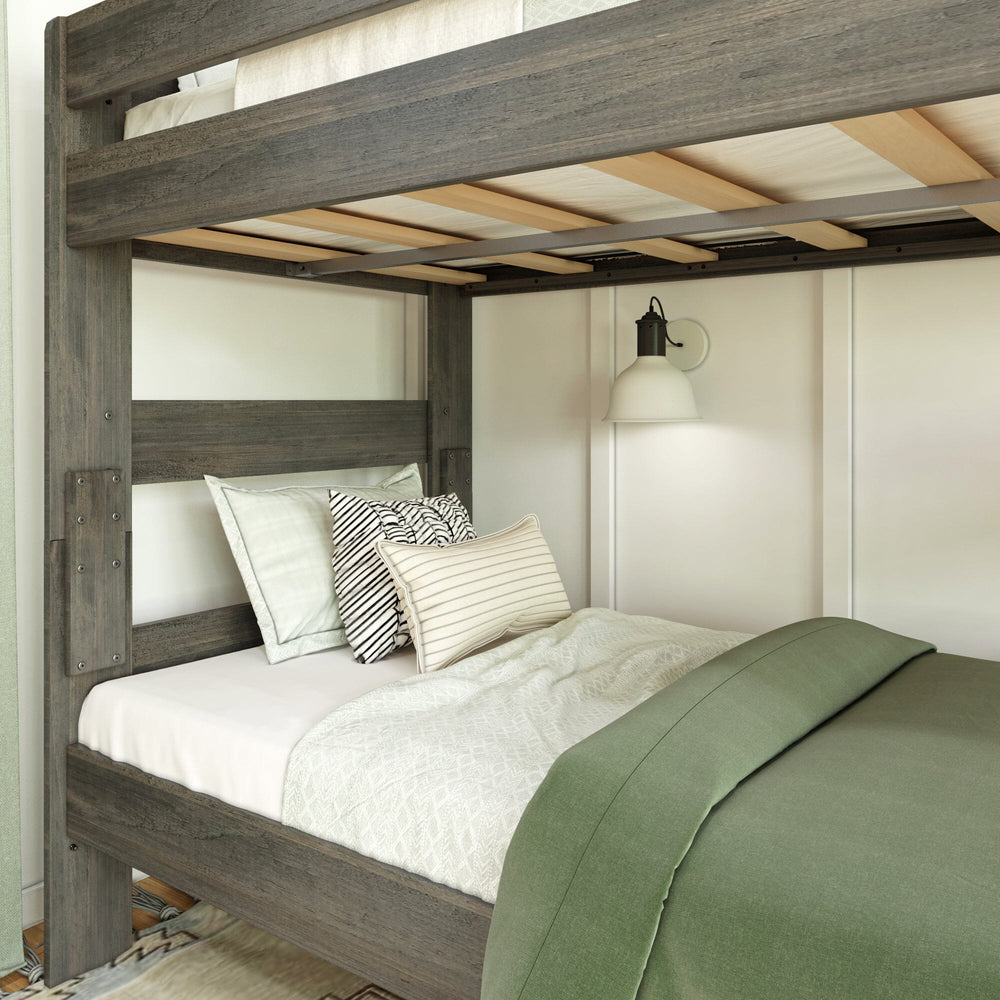 Max & Lily Modern Farmhouse Twin Over Twin Bunk Bed in Driftwood - close-up of the made-up lower bunk with the end ladder and the wood slats supporting the upper mattress overhead