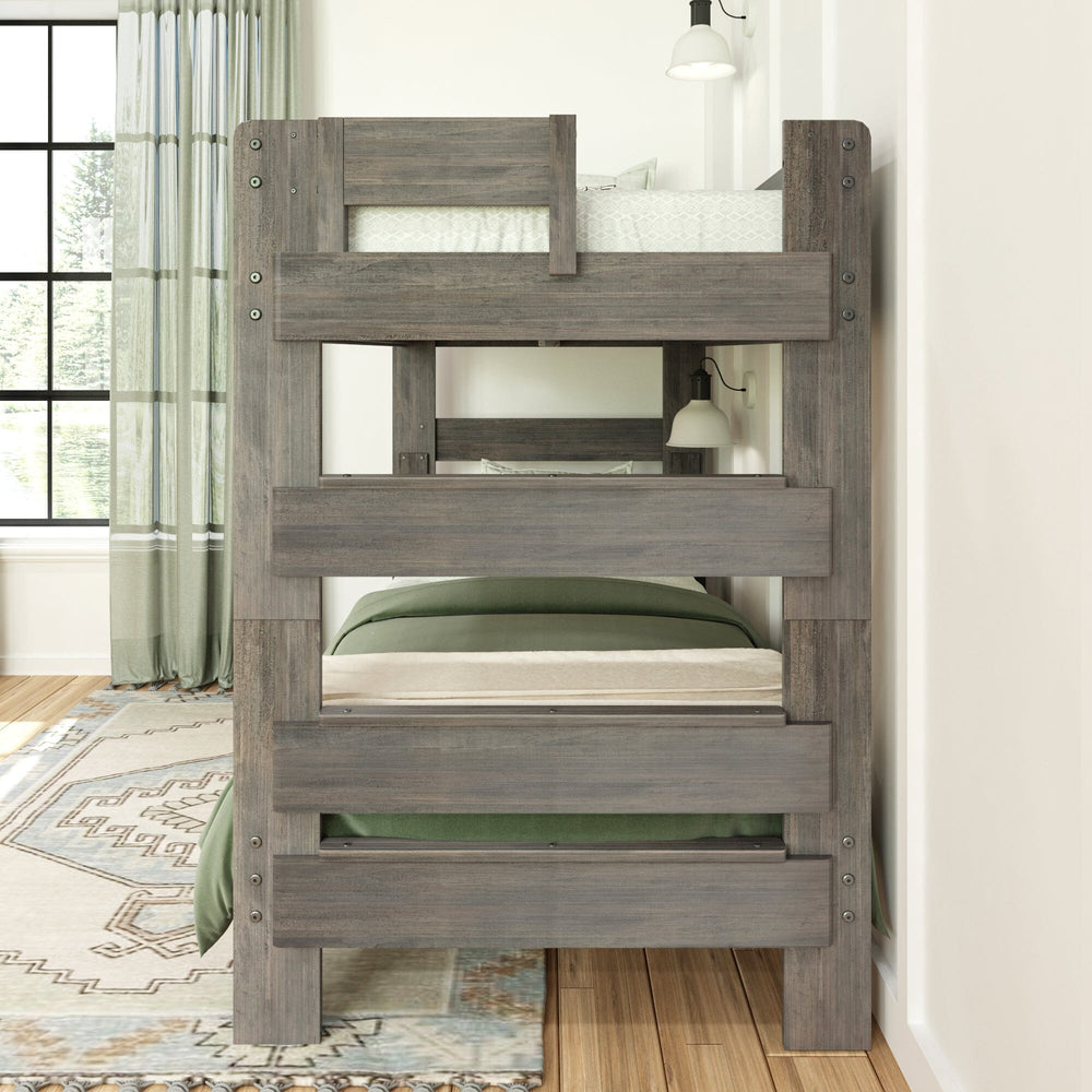 Max & Lily Modern Farmhouse Twin Over Twin Bunk Bed in Driftwood - foot-end view of the made-up bunk bed in a bedroom with green curtains and a patterned rug