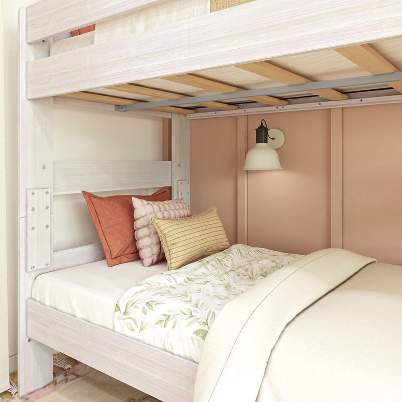 Max & Lily Modern Farmhouse Twin Over Twin Bunk Bed in White Wash - close-up beneath the upper bunk showing the wooden slat platform above the styled lower bed.