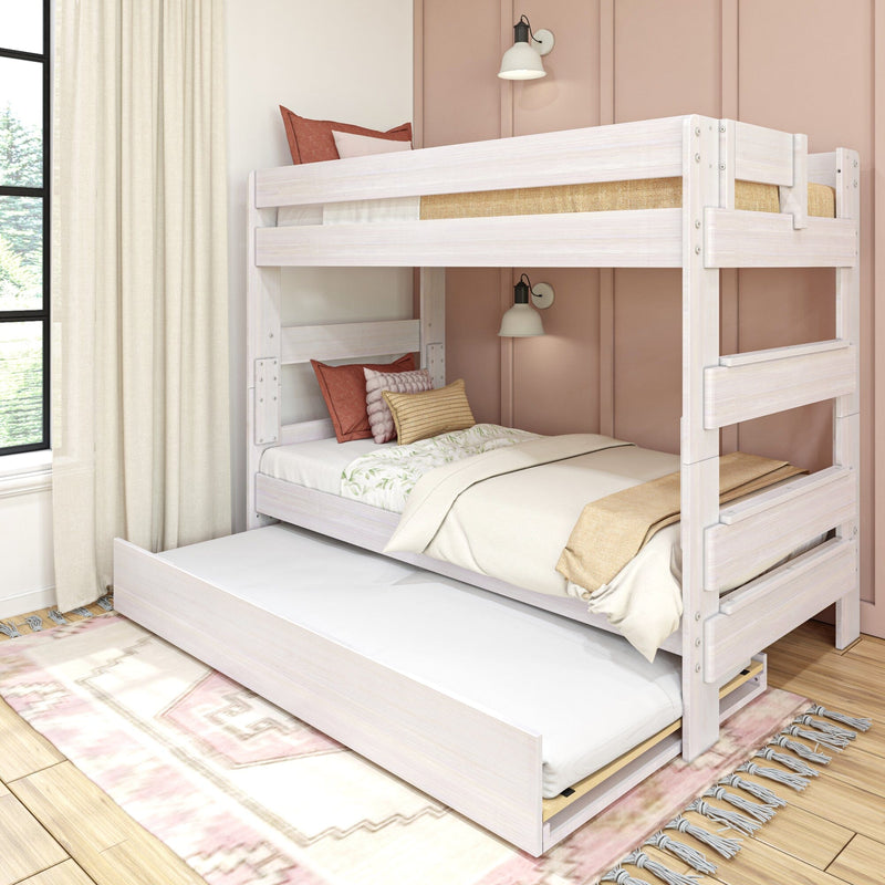 Max & Lily Modern Farmhouse Twin Over Twin Bunk Bed With Trundle in White Wash - angled front view in a styled pink bedroom with the pull-out trundle open and made up