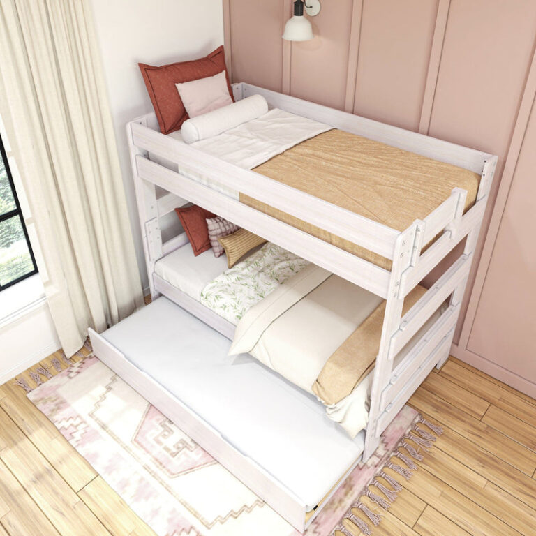 Max Lily Modern Farmhouse Twin Over Twin Bunk Bed With Trundle White Wash Room Scene 6 Max & Lily Modern Farmhouse Twin Over Twin Bunk Bed With Trundle in White Wash - elevated angle view in a pink bedroom with pillows, bedding and the trundle pulled out
