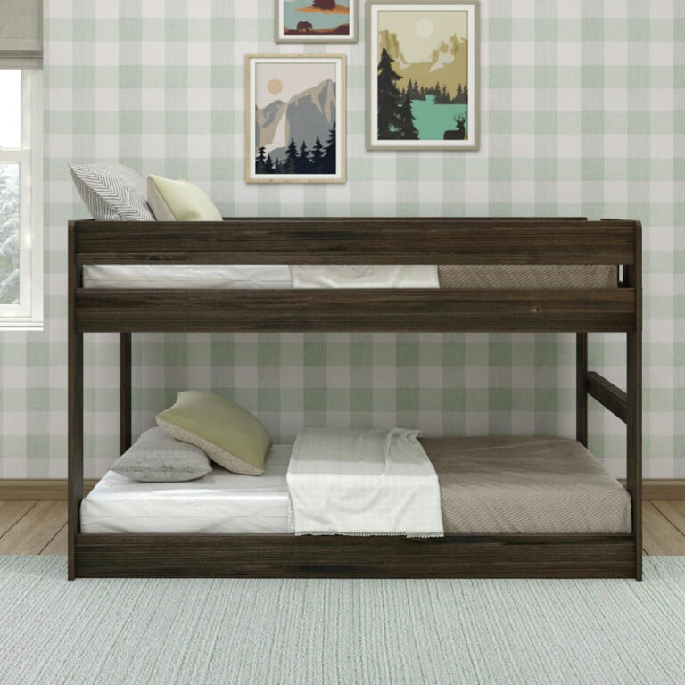 Max & Lily Modern Farmhouse Twin Over Twin Low Bunk Bed in Barnwood Brown - front view of the low bunk bed with both twin mattresses in a decorated bedroom.