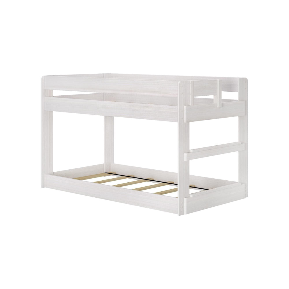 Max & Lily Modern Farmhouse Twin Over Twin Low Bunk Bed in White Wash - angled view of the bare frame showing the integrated side ladder and slatted bases