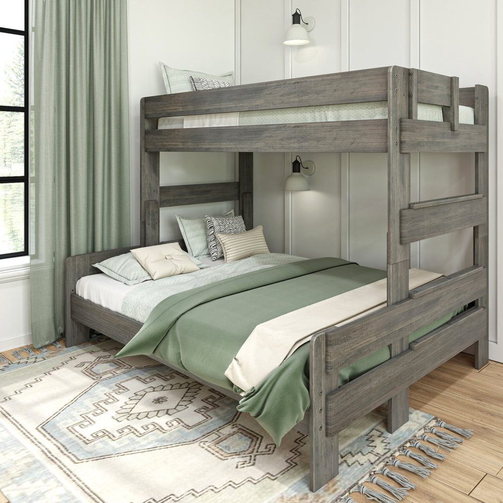 Max & Lily Modern Farmhouse Twin XL-Over-Queen Bunk Bed in Driftwood - angled view in a styled bedroom with green curtains and a patterned area rug.