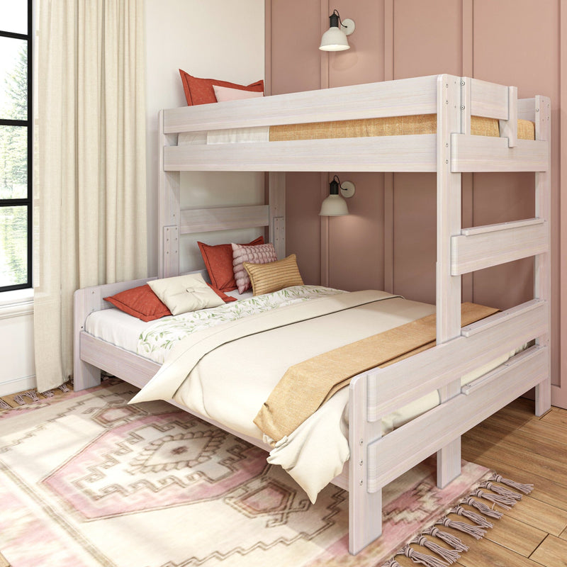 Max & Lily Modern Farmhouse Twin XL-Over-Queen Bunk Bed - angled view styled in a child's bedroom with a woven rug and pink walls