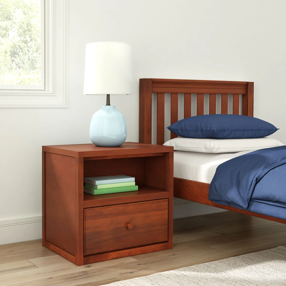 Maxtrix 1 Drawer Nightstand in Chestnut - styled in a kids bedroom beside a matching bed, with a lamp on top and books on the open shelf