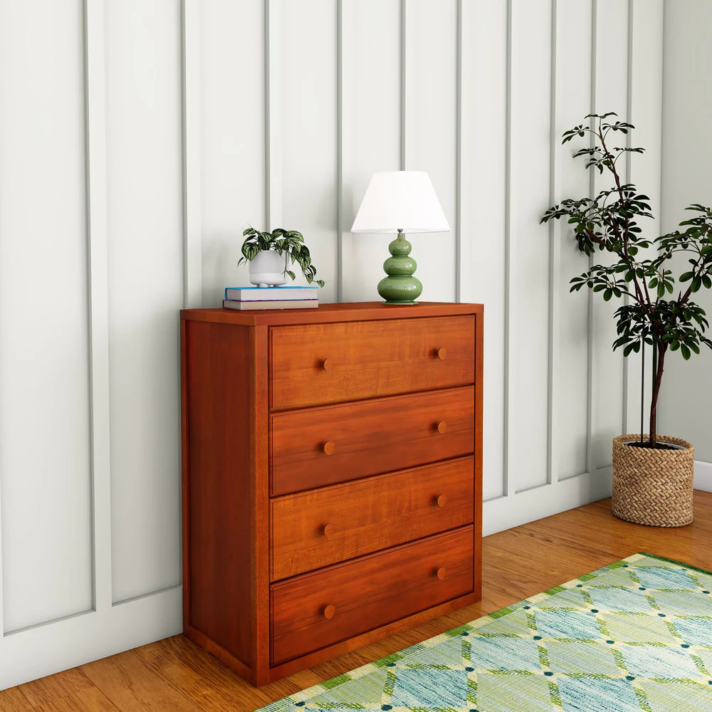 Maxtrix 4 Drawer Dresser Chestnut Room Scene Angle View Maxtrix 4 Drawer Dresser in Chestnut - angled view in a room showing the solid wood side panel and four spacious drawers