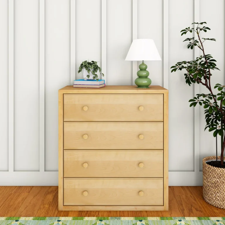Maxtrix 4 Drawer Dresser Natural Room Scene Front View Maxtrix 4 Drawer Dresser in Natural - straight-on front view in a bedroom with a lamp and plant on top, showing four full-width drawers with round wood knobs