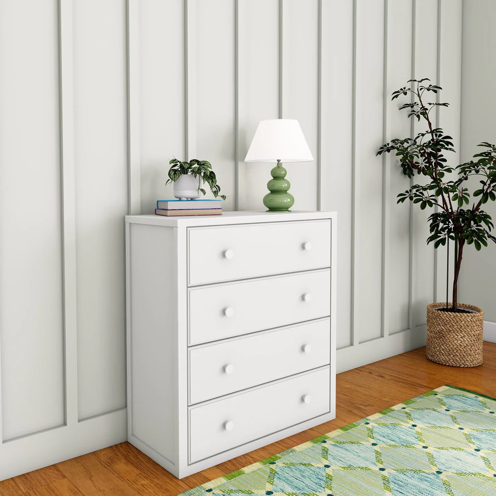 Maxtrix 4 Drawer Dresser White Angle Room Scene Maxtrix 4 Drawer Dresser in White - angled room view showing the side panel and four drawers with double round knobs