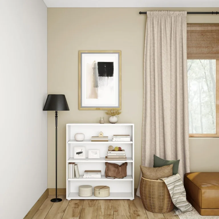 Maxtrix 4 Shelf Bookcase in White - styled in a living room corner with books, framed photos and decor on the shelves beside a window with curtains