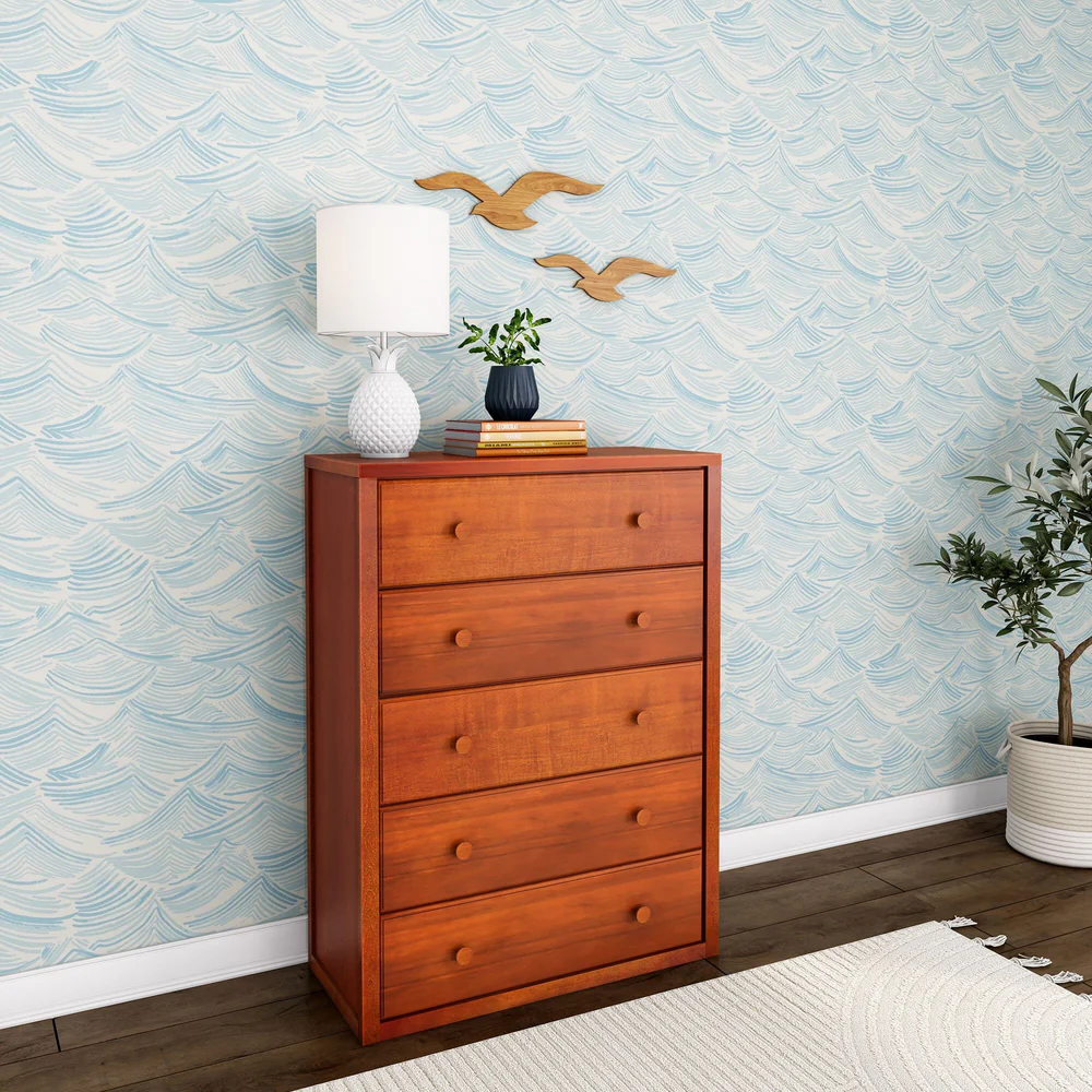Maxtrix 5 Drawer Dresser Chestnut Angle Room Scene 4 Maxtrix 5 Drawer Dresser in Chestnut - angled room view beside an olive plant, showing the solid wood side panel and five drawers