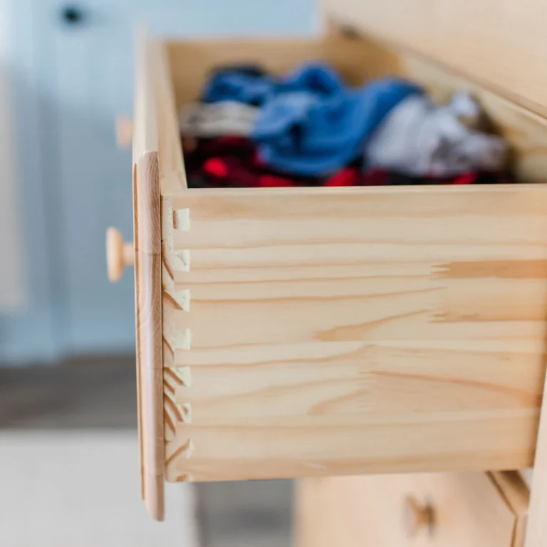 Maxtrix 5 Drawer Dresser Natural Dovetail Drawer Detail Maxtrix 5 Drawer Dresser in Natural - closeup of an open drawer showing dovetail joinery with folded clothes inside