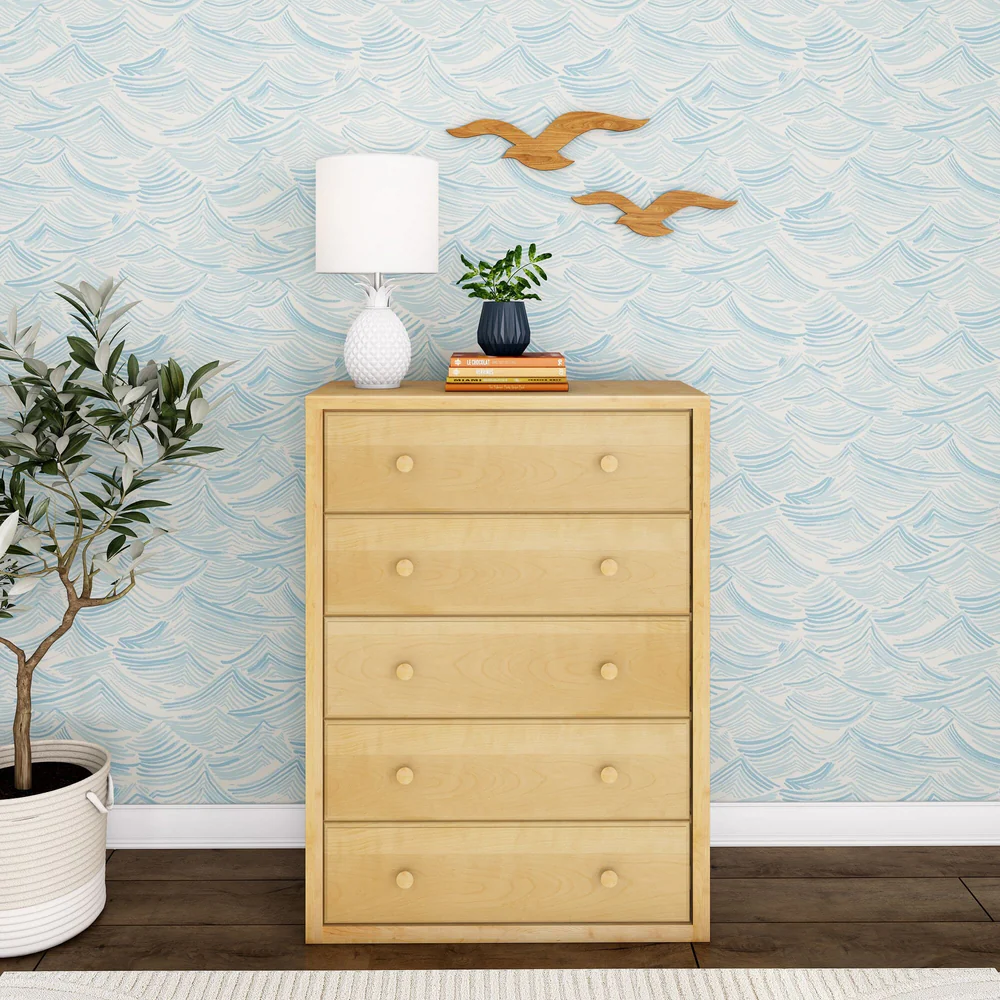 Maxtrix 5 Drawer Dresser Natural Front Room Scene Maxtrix 5 Drawer Dresser in Natural - front view in a styled bedroom with wave-print wallpaper and decor on top