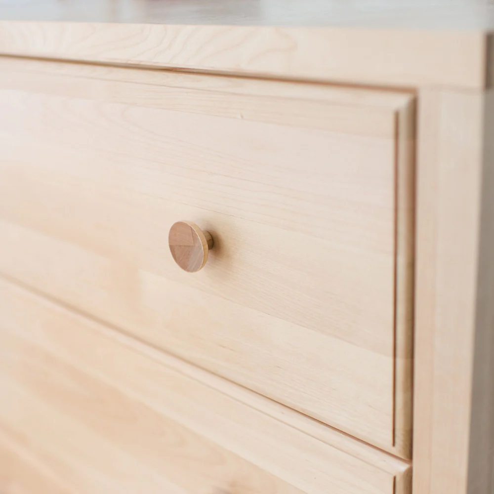 Maxtrix 5 Drawer Dresser Natural Knob Closeup Maxtrix 5 Drawer Dresser in Natural - closeup of a round solid wood drawer knob and smooth finish