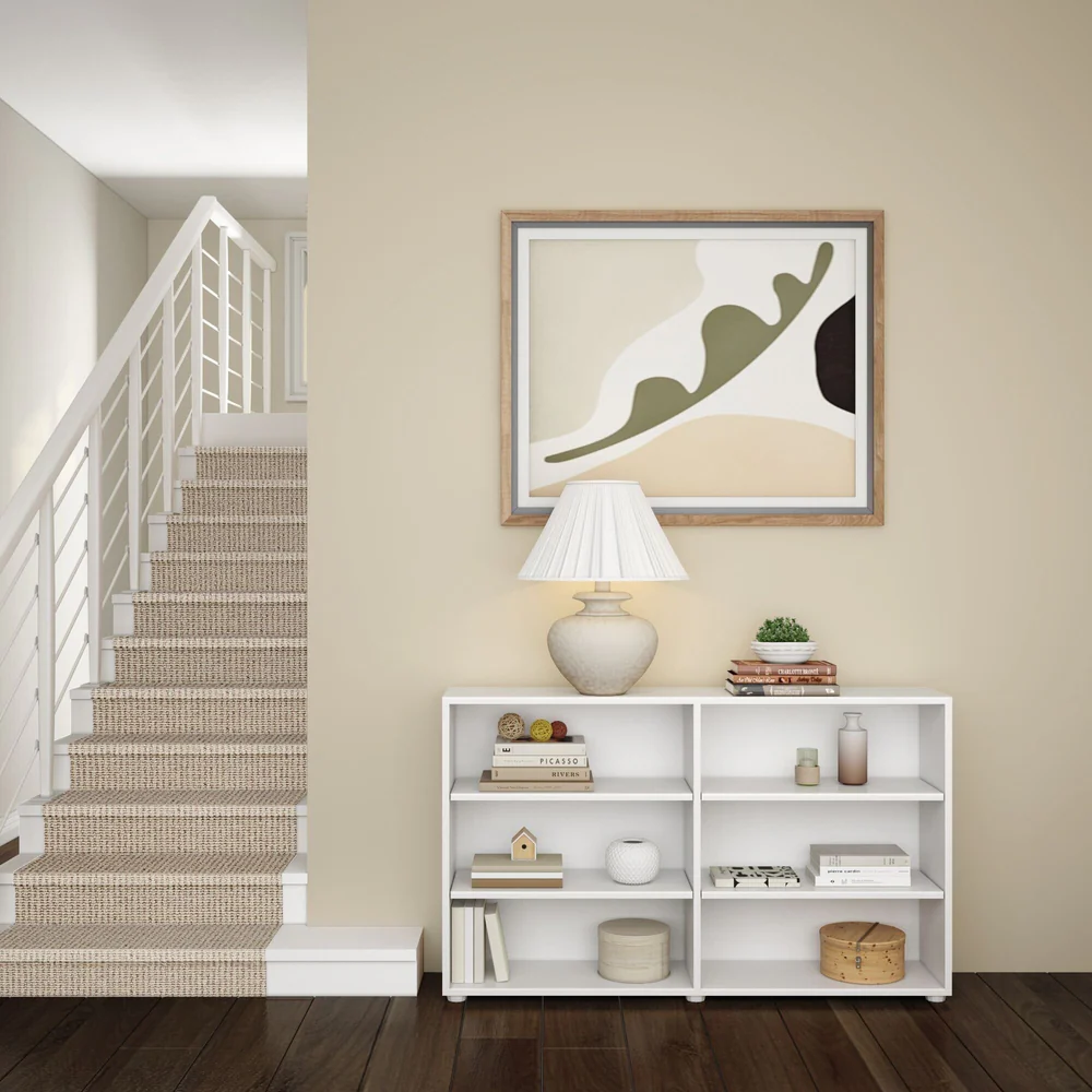 Maxtrix 6 Shelf Bookcase in White - bookcase in a hallway by a staircase, shelves styled with books, a lamp and decor