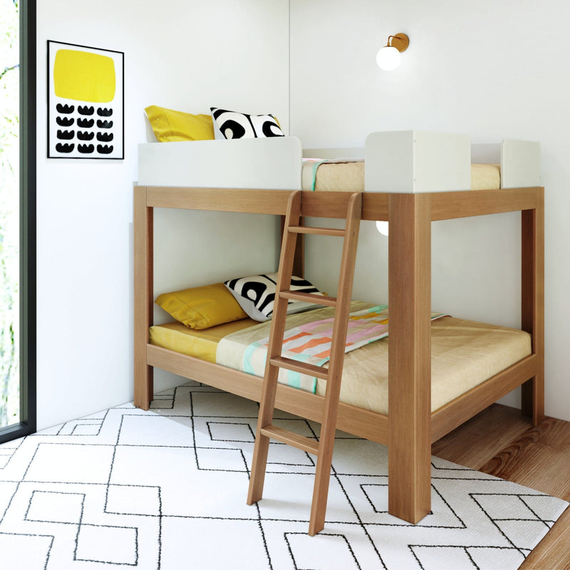 Mid-Century Modern Full Over Full Bunk Bed in White/Pecan - angled view in a styled bedroom with an angled ladder, patterned rug, and framed wall art.