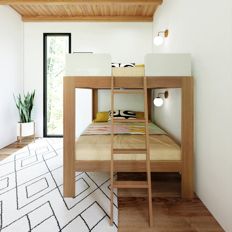 Mid-Century Modern Full Over Full Bunk Bed in White/Pecan - front view in a styled bedroom with a potted plant, rug, and wall sconces.