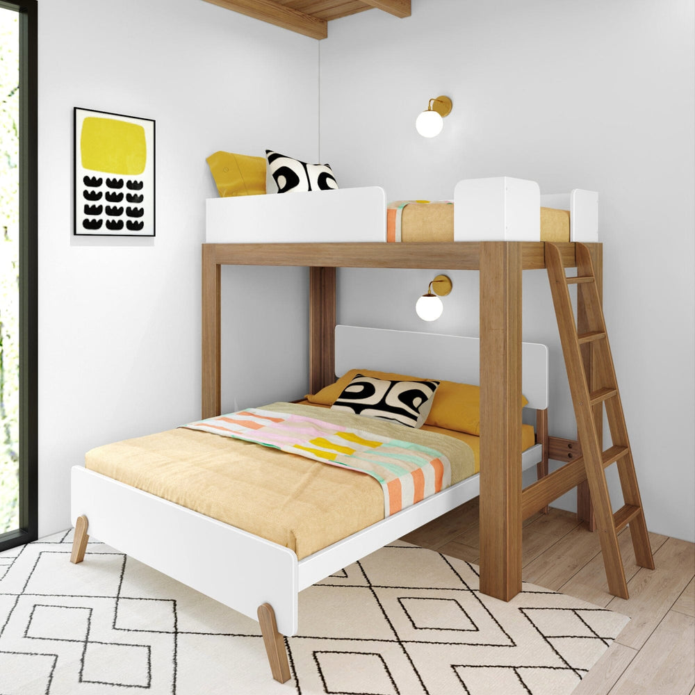 Mid-Century Modern Twin Over Full L-Shaped Bunk Bed in White/Pecan - angled view in a styled kids room showing the raised twin bed with safety guardrails, the perpendicular full bed below, and the angled wood ladder