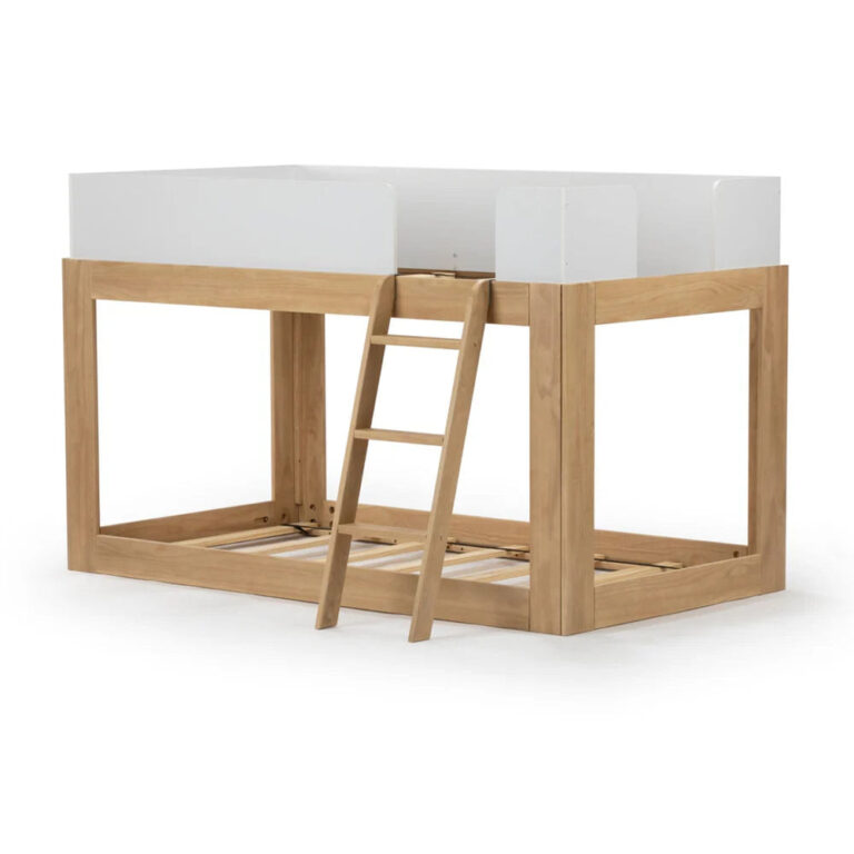 Mid-Century Modern Twin Over Twin Low Bunk Bed in White/Blonde - bare frame angle view showing wood slats, white guardrail panels and attached ladder