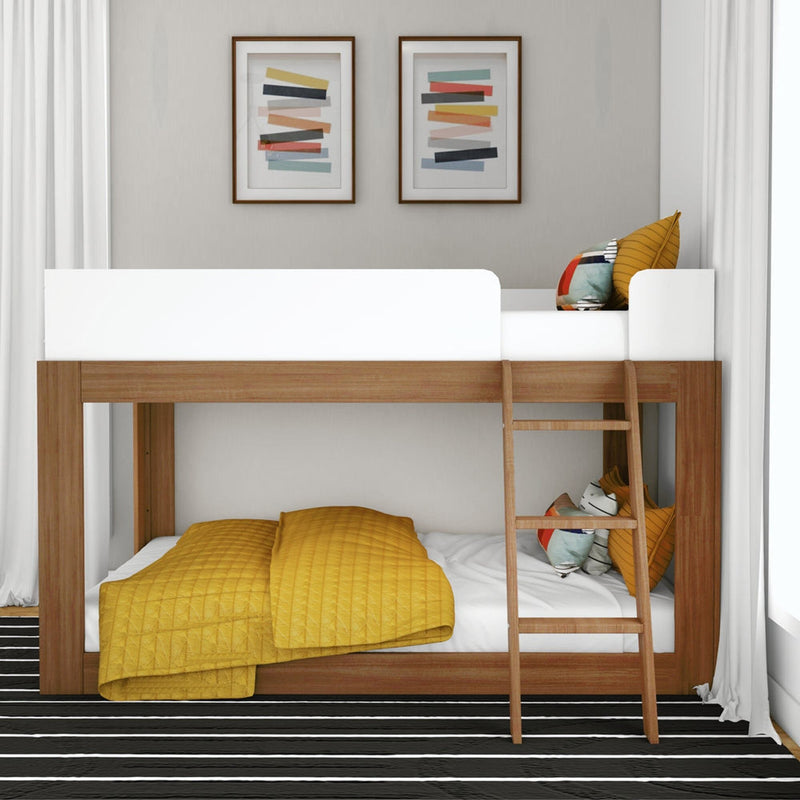 Mid-Century Modern Twin Over Twin Low Bunk Bed in White/Pecan - front view in a styled bedroom showing the low wood frame, white top-bunk guardrails and angled ladder