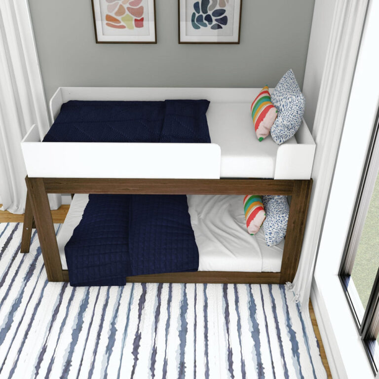 Mid-Century Modern Twin Over Twin Low Bunk Bed in White/Walnut - overhead angle showing the top bunk with white safety guardrails and the lower bunk beneath