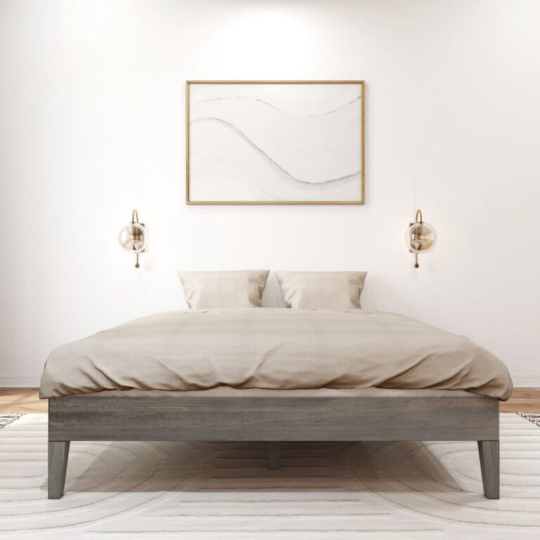 Queen Size Platform Bed Driftwood Front View Queen Size Platform Bed in Driftwood - front view of the foot of the made-up bed flanked by wall sconces and framed art in a bright bedroom.