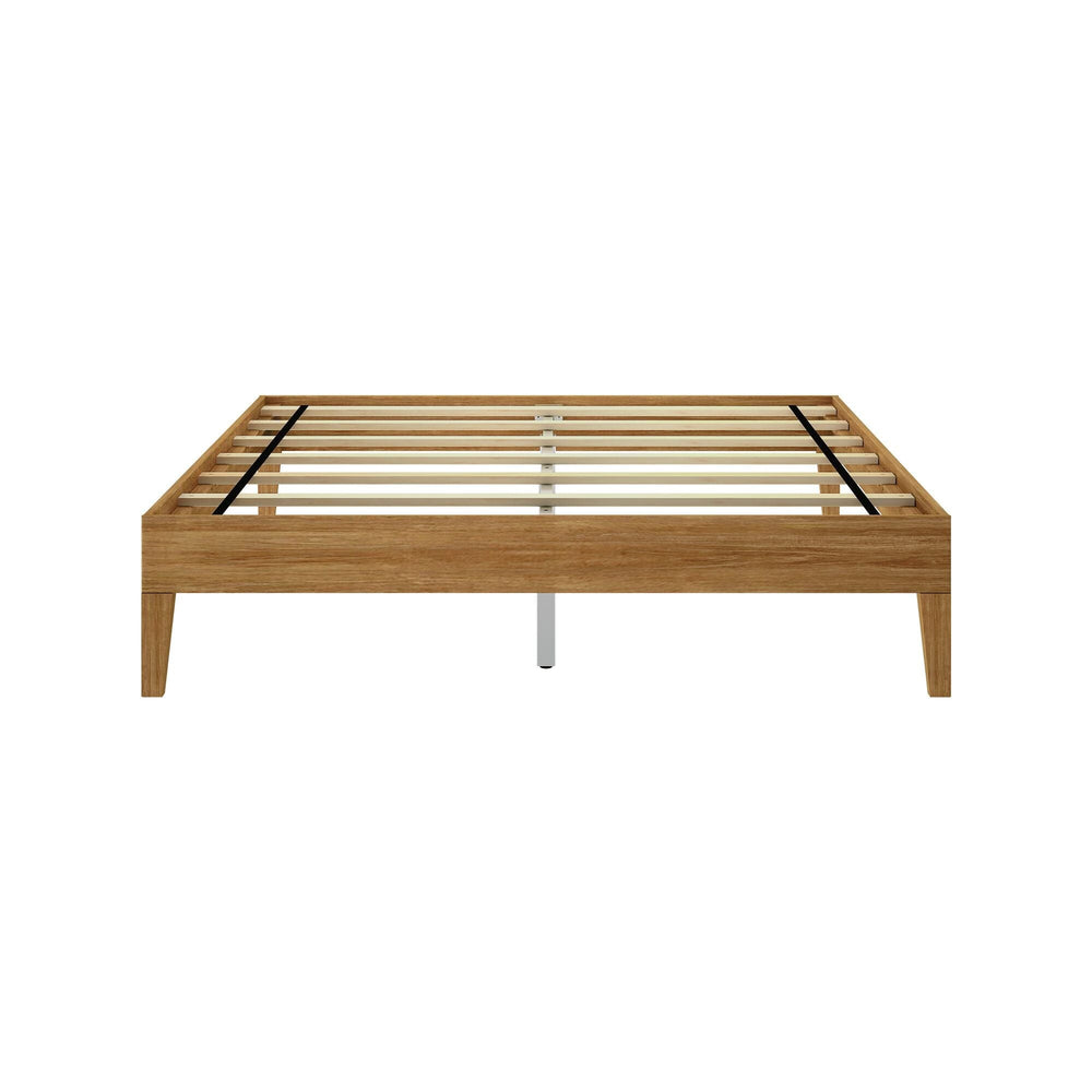 Queen Size Platform Bed Pecan Frame Detail Queen Size Platform Bed in Pecan - close-up of the low frame and tapered leg with a duvet draped over the mattress