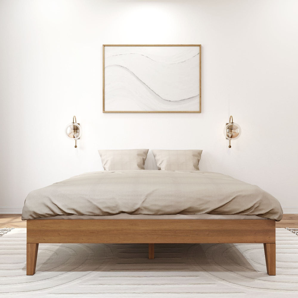 Queen Size Platform Bed Pecan Front View Queen Size Platform Bed in Pecan - front view styled with a duvet and pillows between two wall sconces below framed wall art